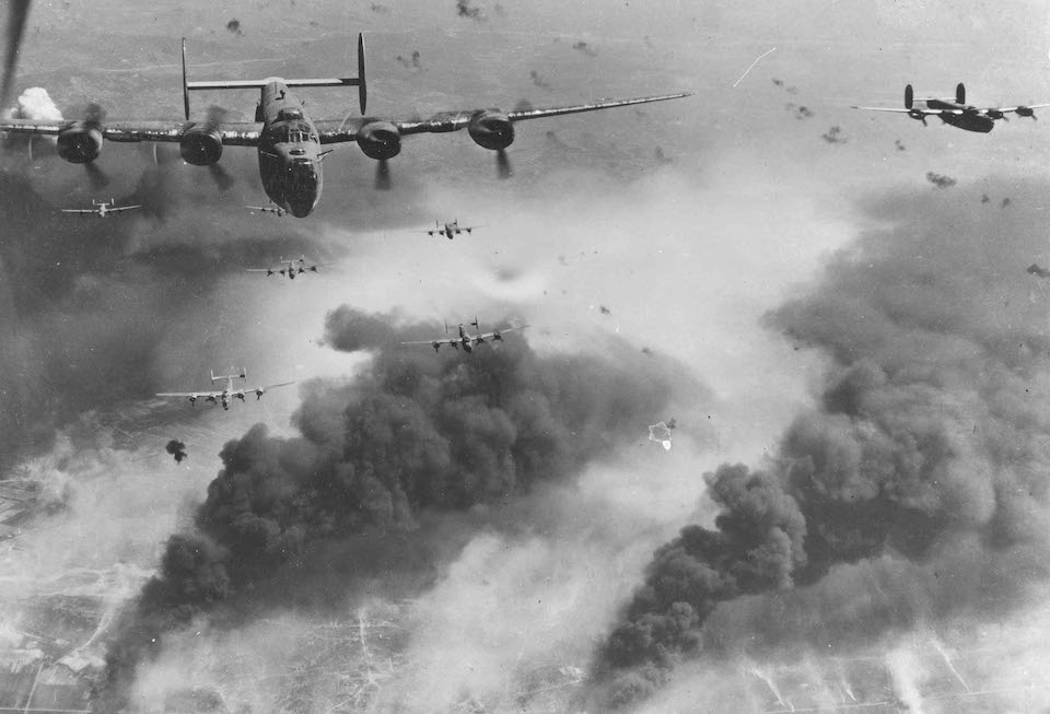 B-24 Liberator Through flak and over the destruction created by preceding waves of bombers, these 15th Air Force B-24s leave Ploesti, Rumania, after one of the long series of attacks against the No. 1 oil target in Europe. (U.S. Air Force photo)