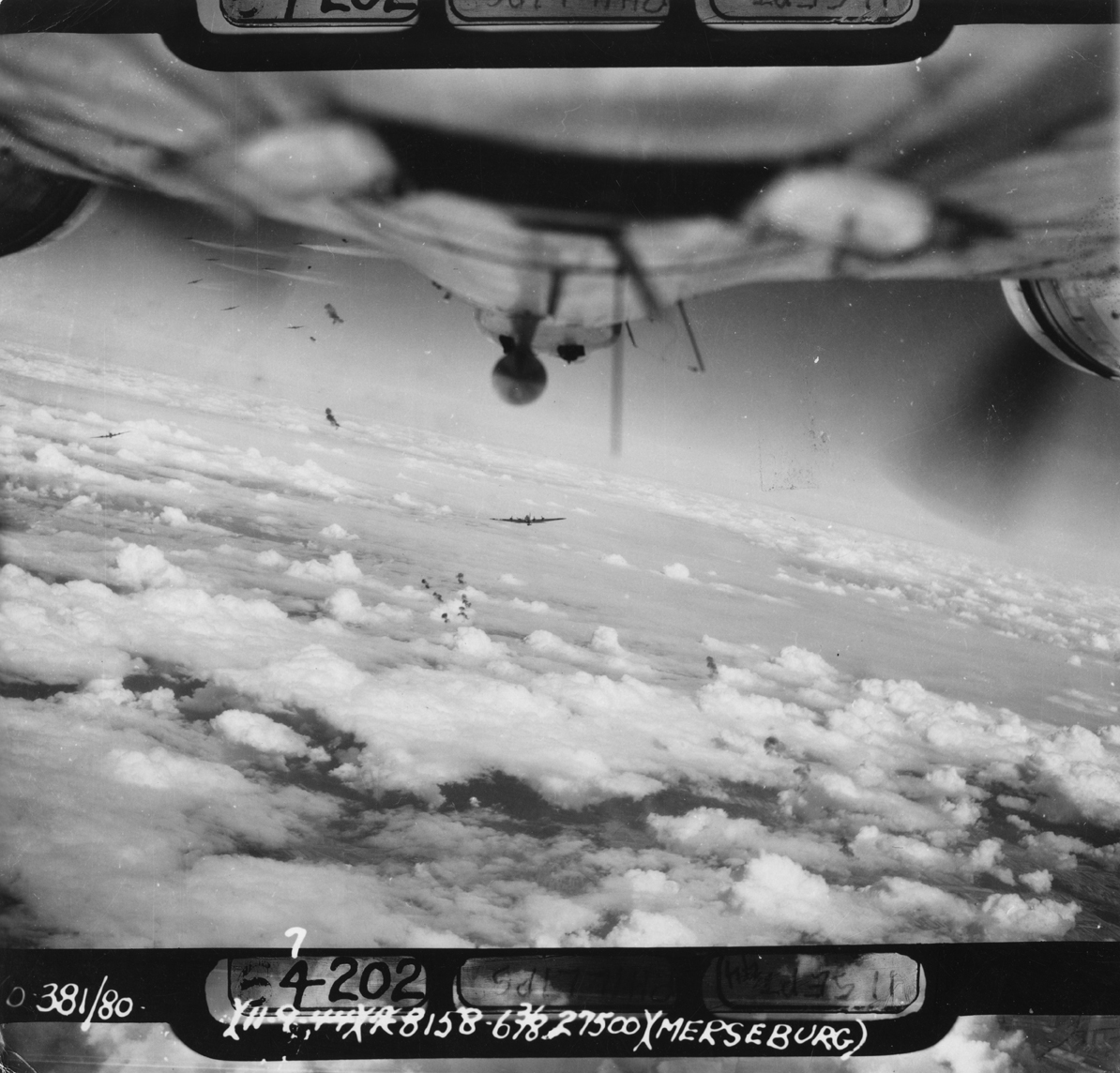 B-17 Flying Fortresses of the 381st Bomb Group fly through flak during a mission over Merseburg. Photographed from a B-17. Even if this is not related to Walter E. Poulsen, his view from the ball turret must have been similar. (© IWM, FRE 4857)