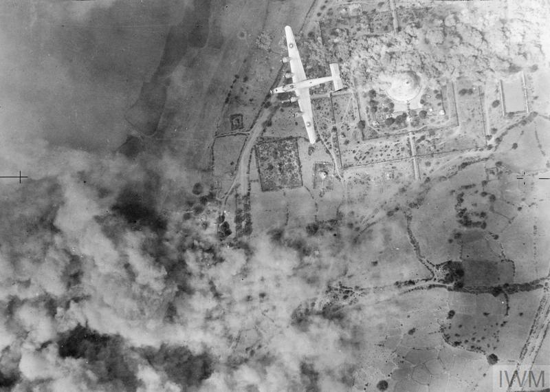 A Consolidated Liberator VI of 231 Group passes over the Kaunghmudaw Pagoda, Burma, during a concentrated attack by units of the Strategic Air Force on Japanese fortified headquarters in the vicinity. It is presumed that it is during the attack on 22 February 1945 in which Bruun took part. (© IWM CI 1904)